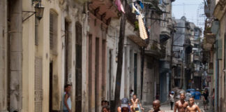 Kids playing street football in Havana.