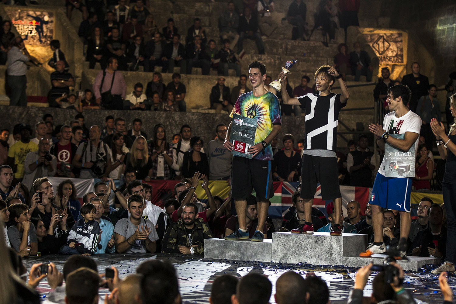 Kotaro Tokuda of Japan (first), Daniel Dennehy of Ireland (second) and Gunther Celli of Italy (third) celebrate during the prizegiving ceremony of the Red Bull Street Style World Final, Lecce, Italy on September 22nd 2012. // Damiano Levati/Red Bull Content Pool // P-20120923-00077 // Usage for editorial use only // Please go to www.redbullcontentpool.com for further information. //